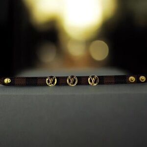 Leather N metal bracelet dark brown checkered pattern gold circular studs L logo